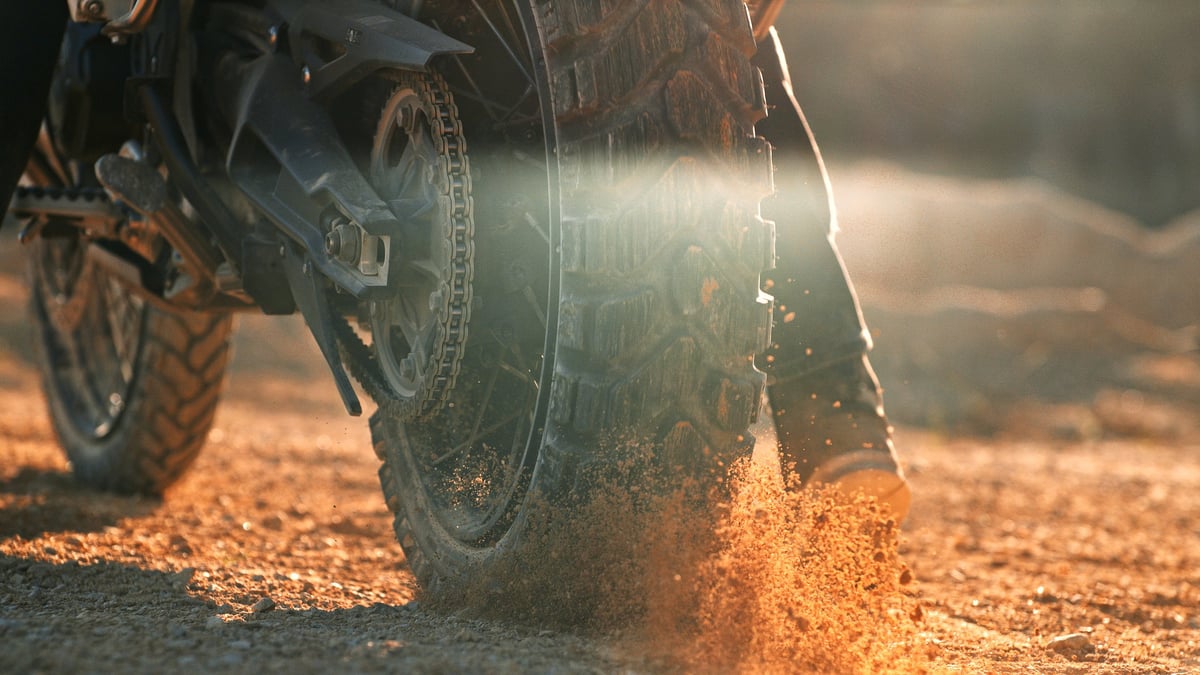 Flying rocks and dust from motocross bike